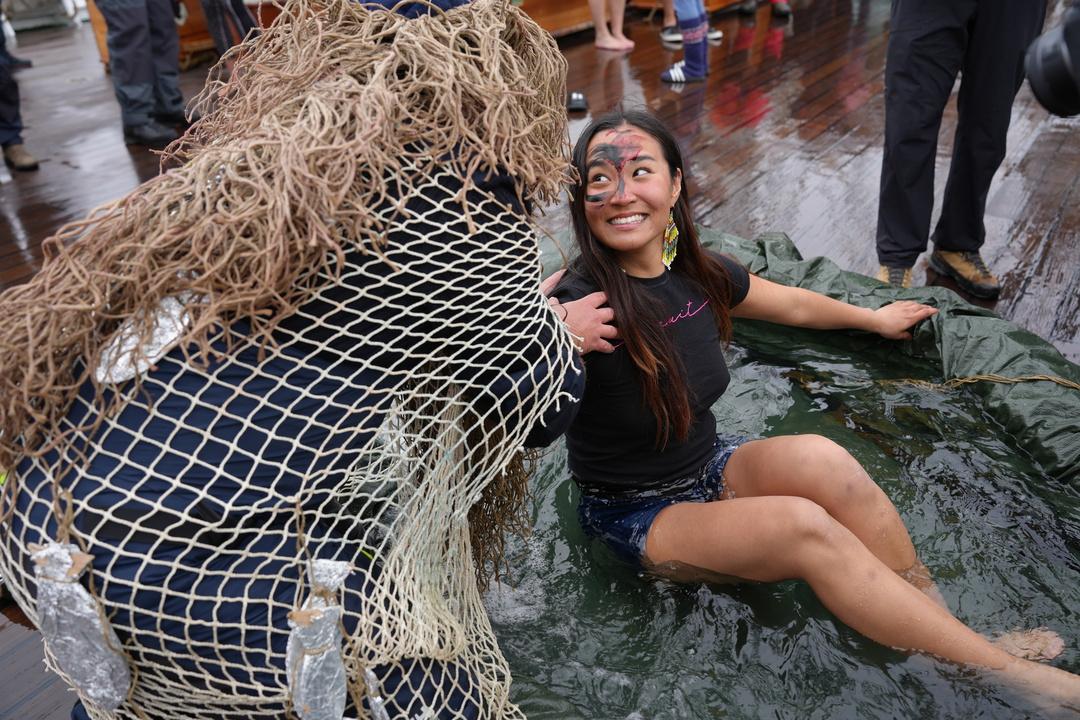 A person is smiling to another person